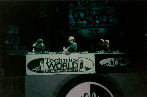 DJ KC performing alongside two other DJs